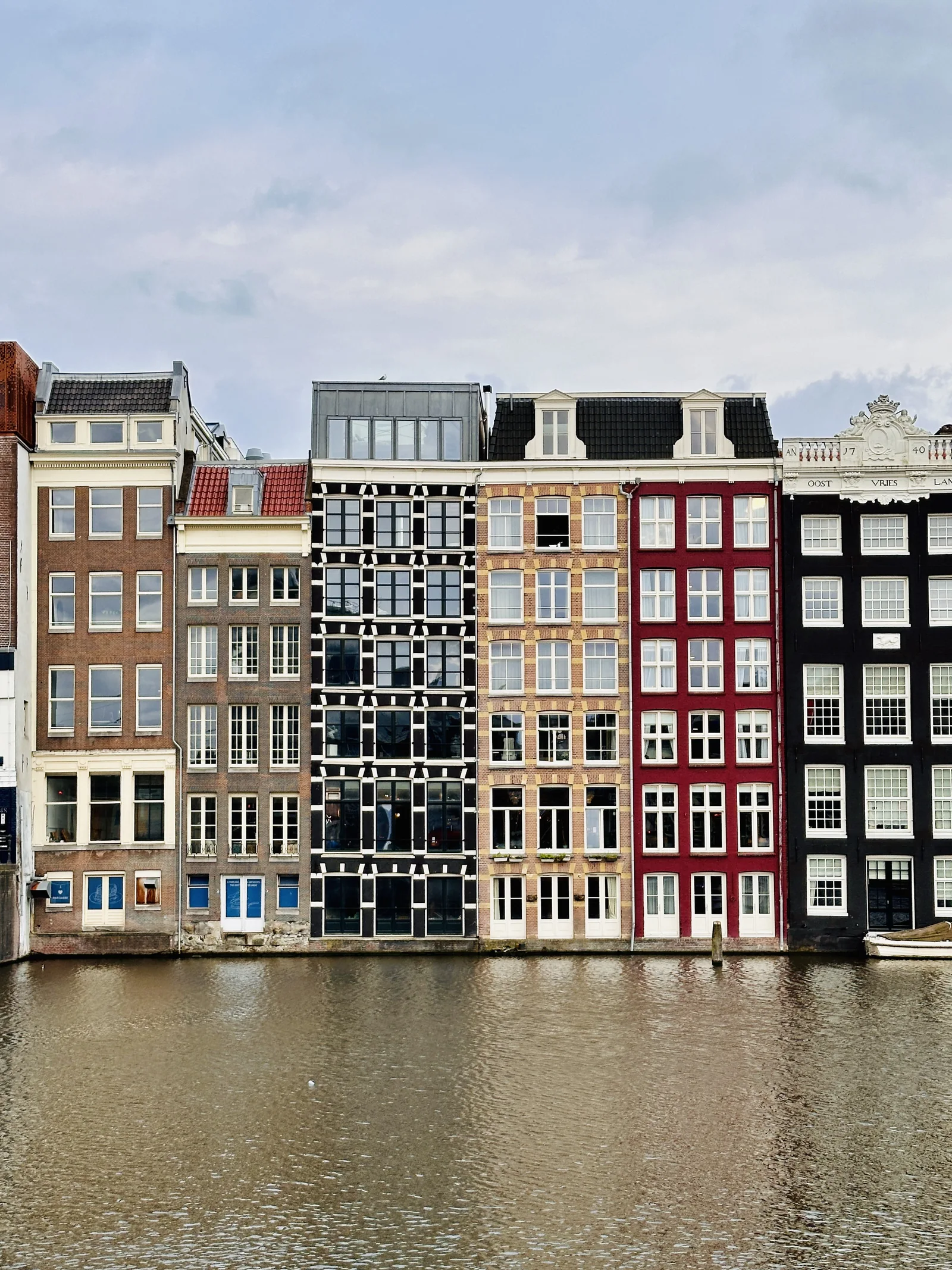 Colorful narrow buildings beside a canal